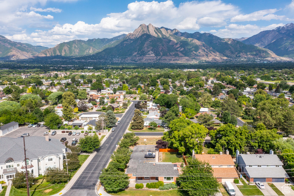 Aerial view of residential area featuring a mountainous background