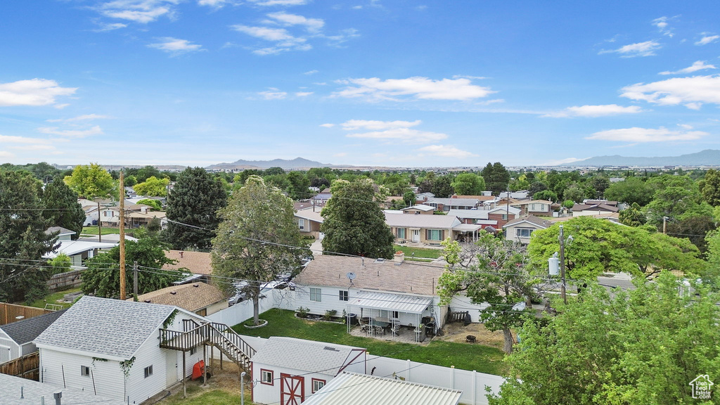 Aerial perspective of suburban area with a mountain backdrop
