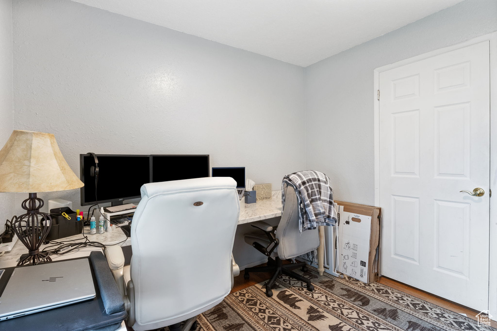 Home office featuring wood finished floors