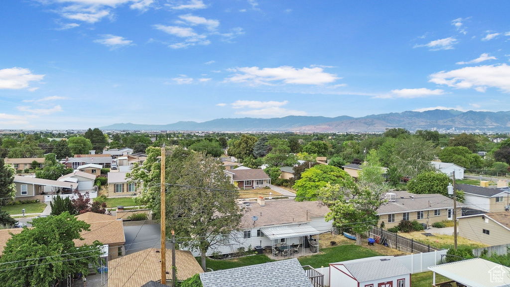 Aerial view of residential area with a mountainous background