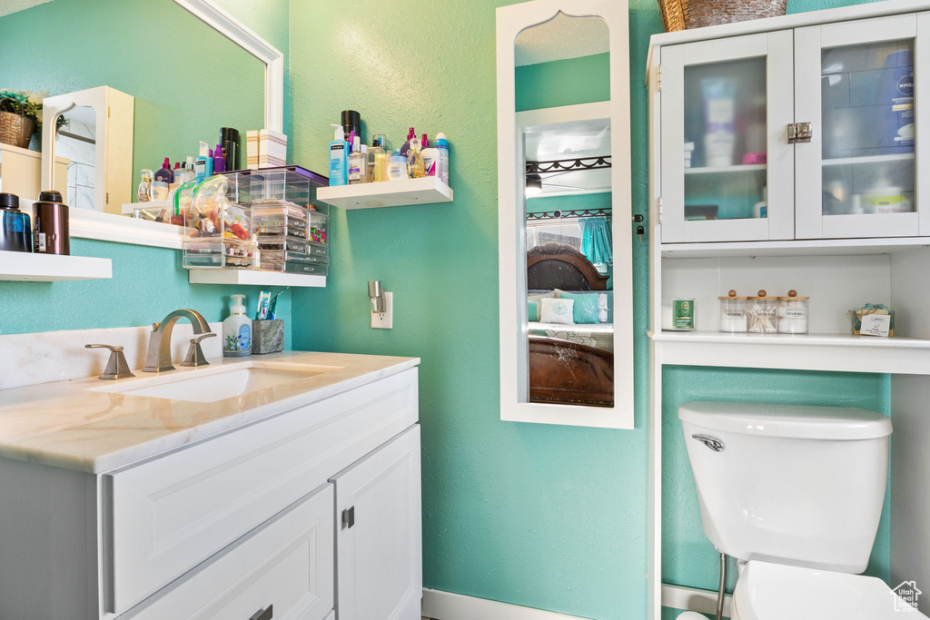 Bathroom with vanity and toilet