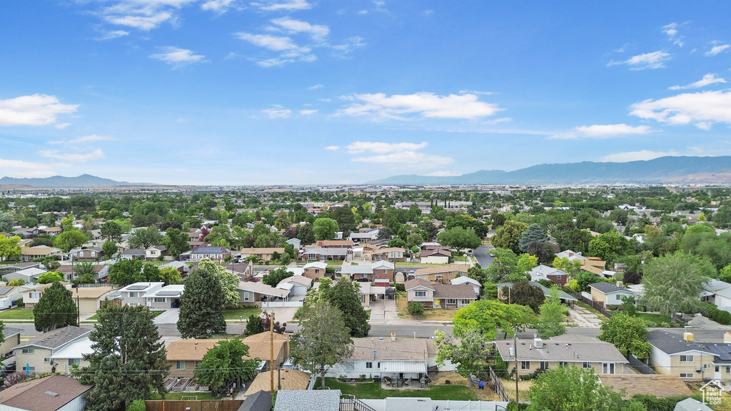 Aerial perspective of suburban area with a mountainous background