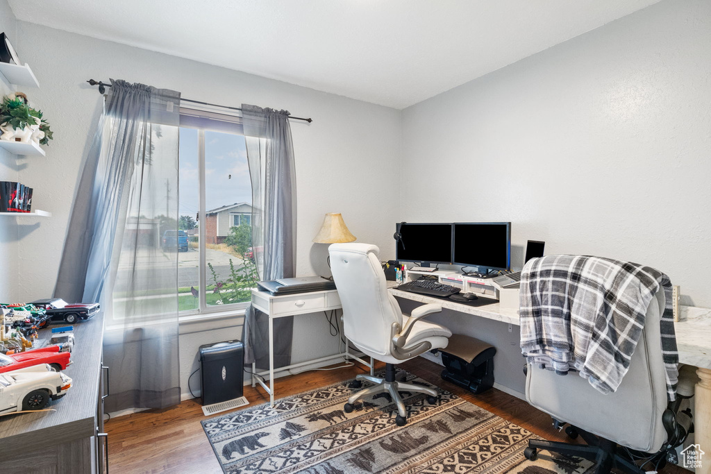 Office area featuring wood finished floors