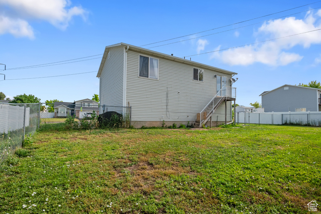 Rear view of house featuring stairs
