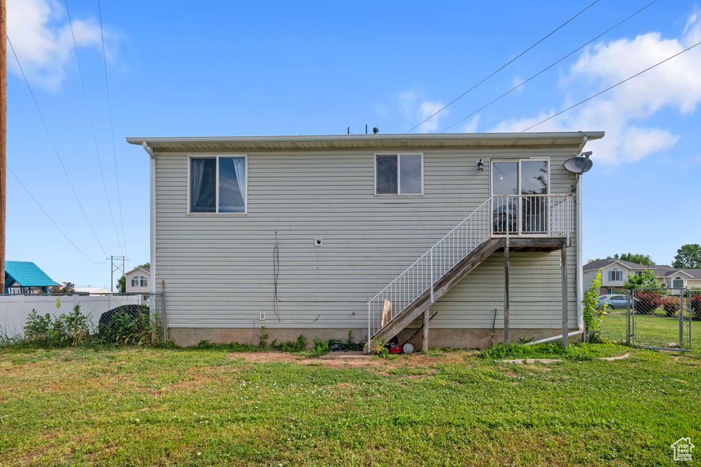 Rear view of property with stairway