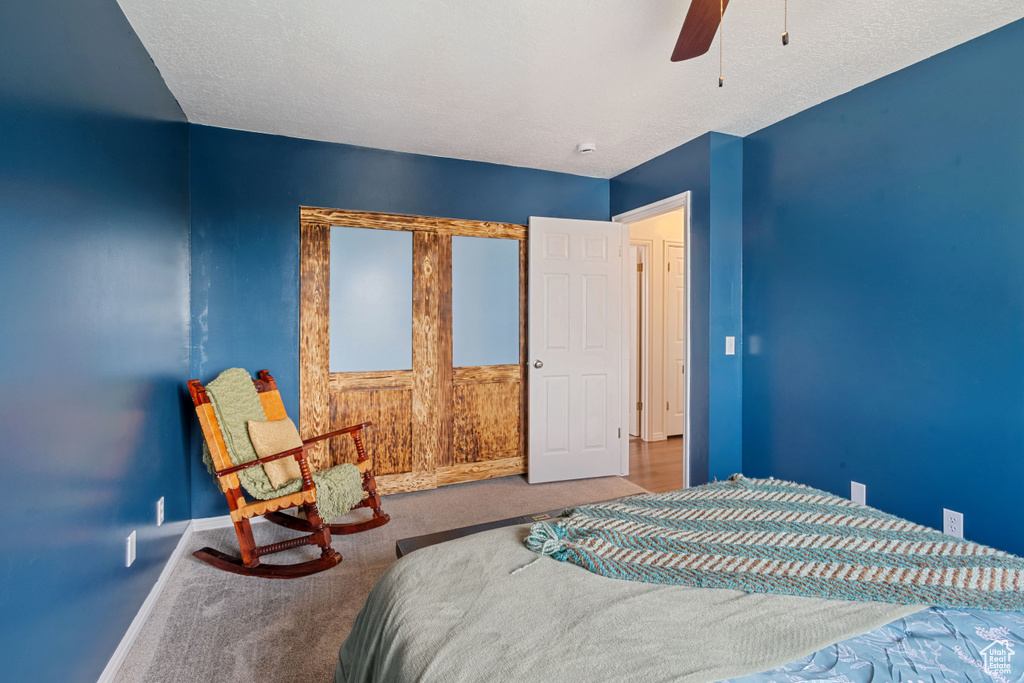 Bedroom featuring carpet and ceiling fan