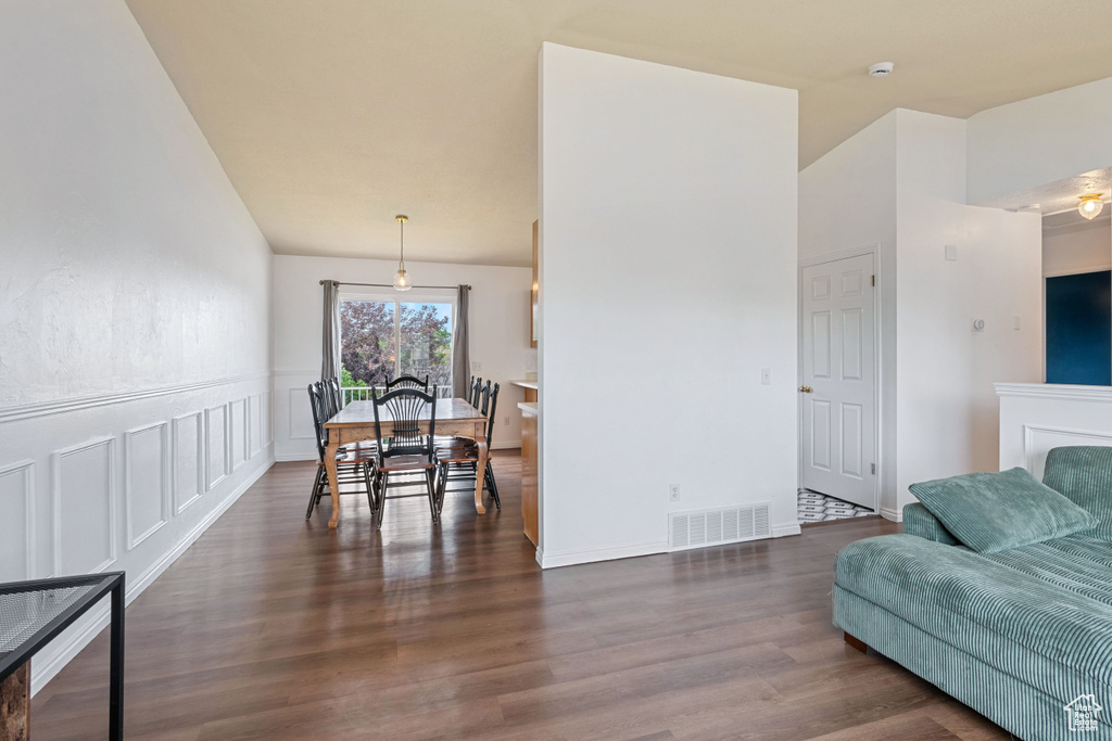Living area featuring dark wood-style floors