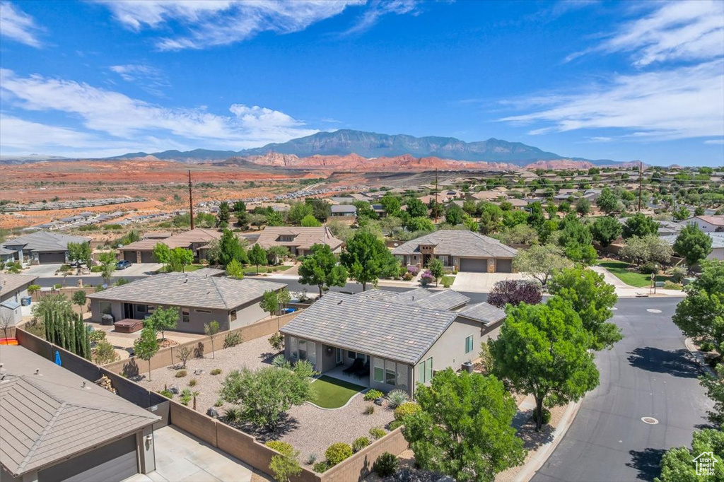 Aerial perspective of suburban area with a mountain backdrop