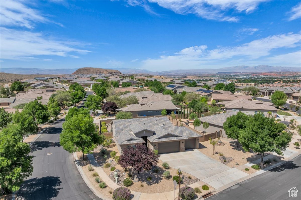 Aerial perspective of suburban area with a mountainous background
