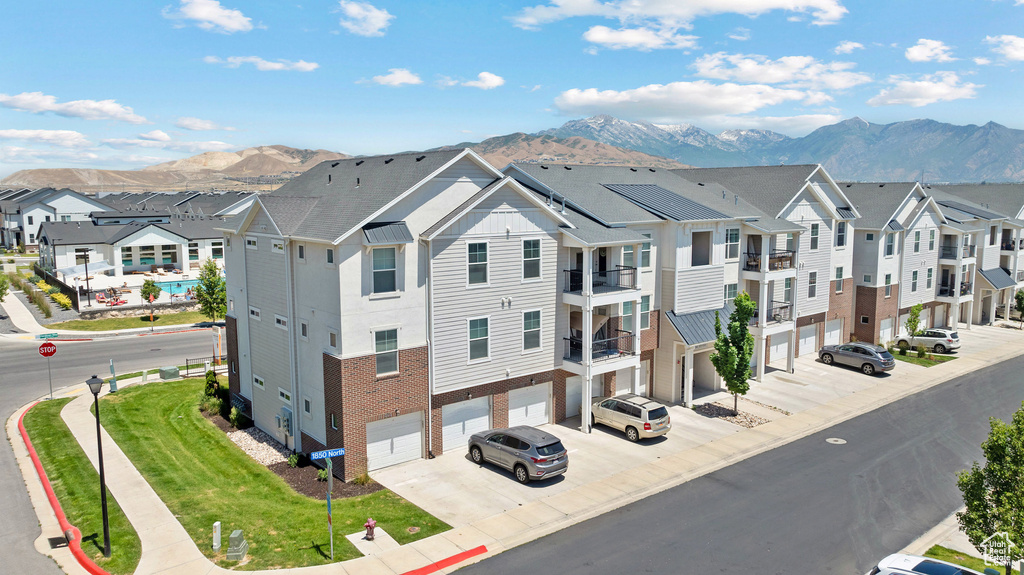 Aerial perspective of suburban area featuring a mountain backdrop