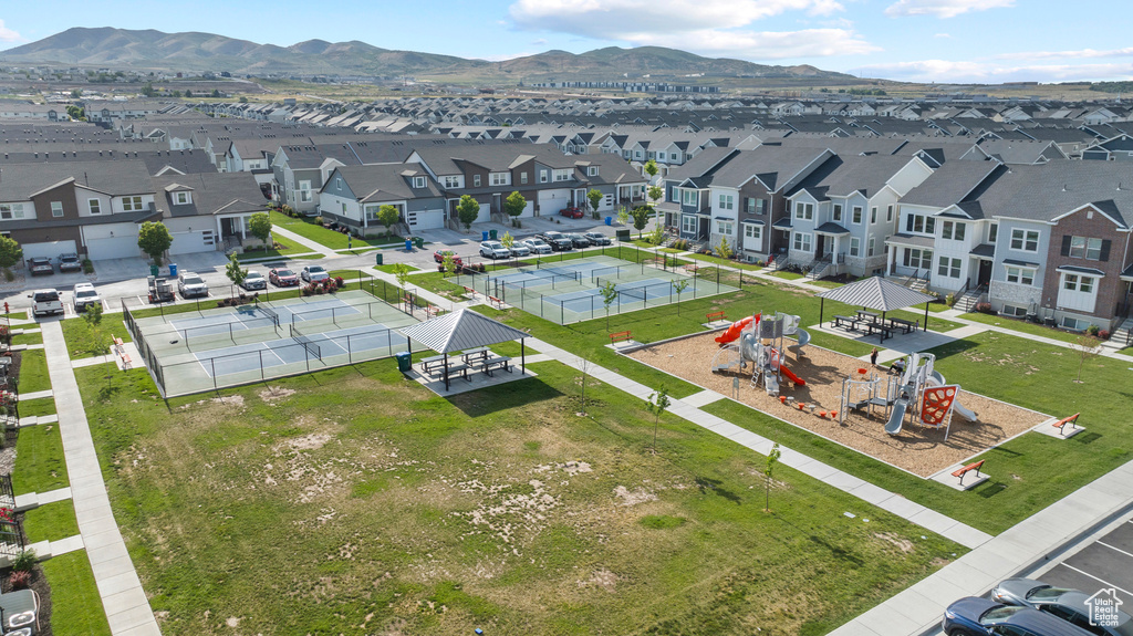 Aerial perspective of suburban area featuring a mountain backdrop