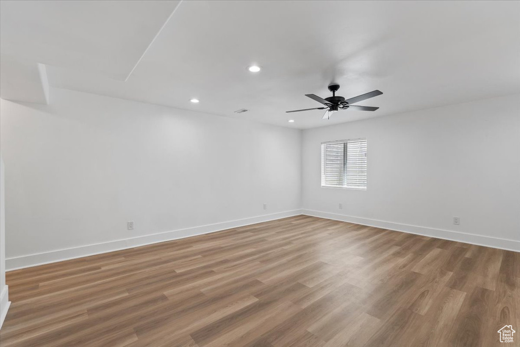 Spare room with recessed lighting, a ceiling fan, and wood finished floors
