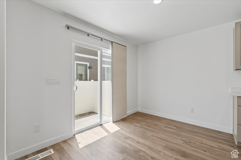 Empty room featuring light wood-style floors and baseboards
