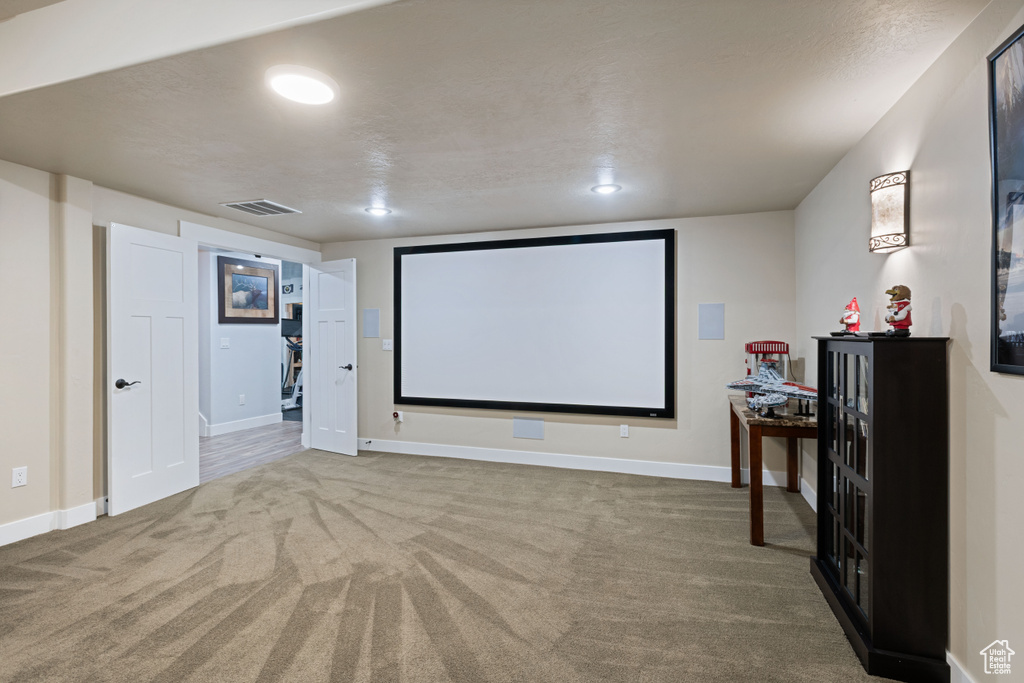 Home theater featuring carpet and recessed lighting