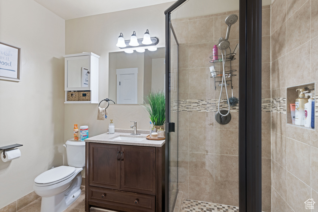 Bathroom with a shower stall and vanity