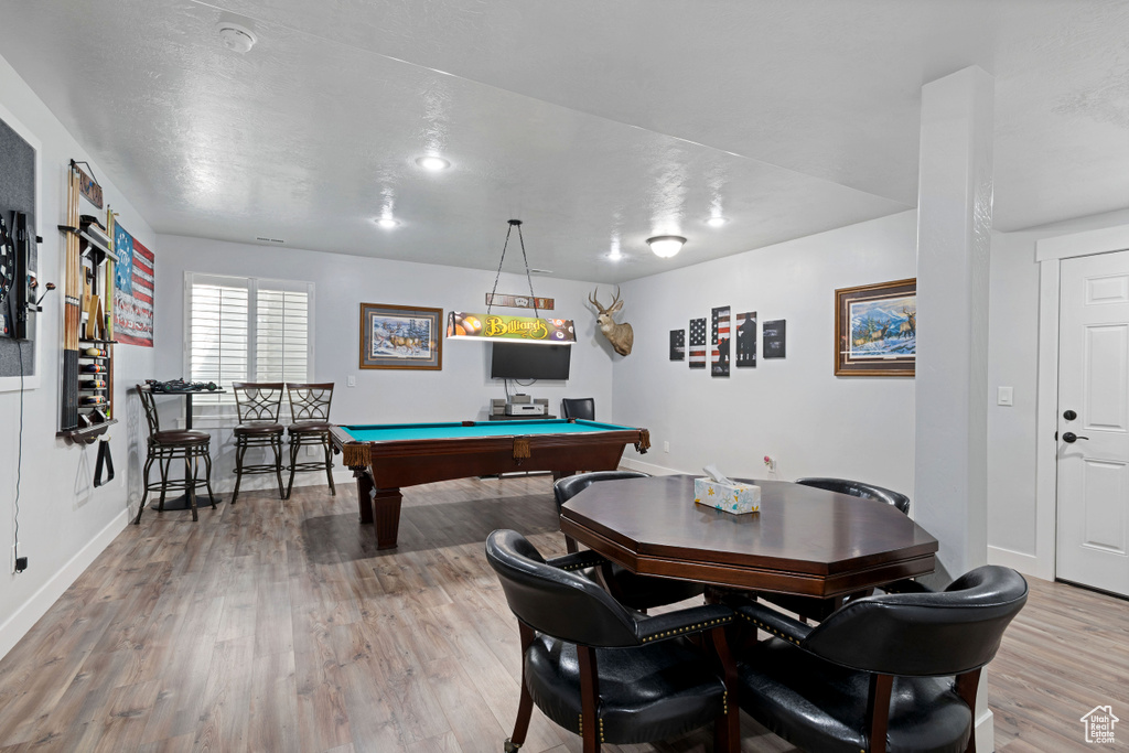 Recreation room featuring light wood-style floors and billiards table