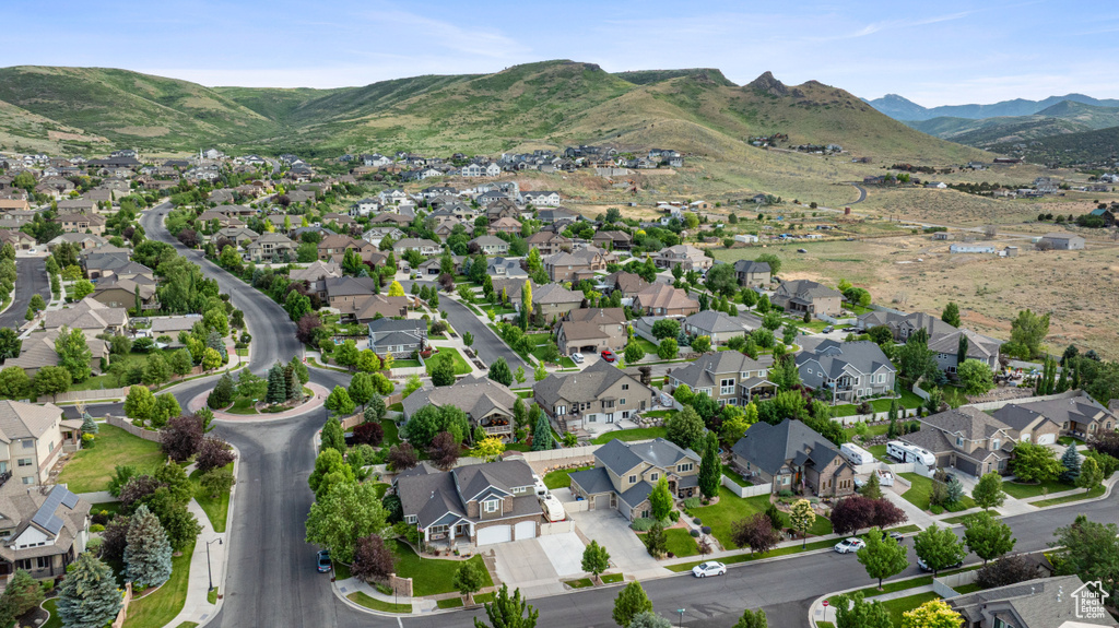 View of property location featuring nearby suburban area and mountains