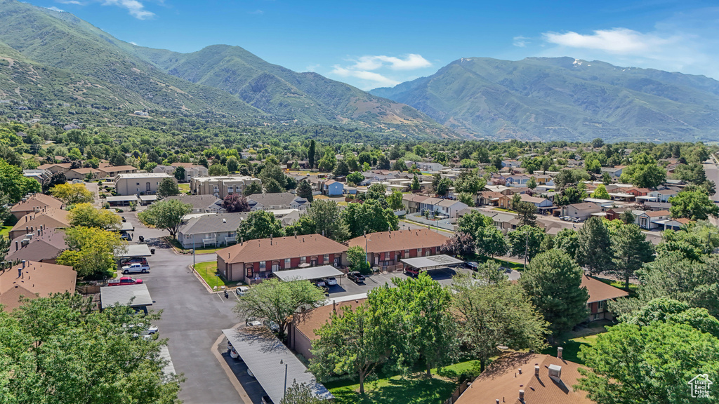 Aerial perspective of suburban area featuring a mountainous background