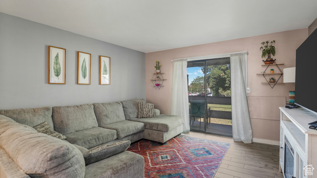 Living room featuring wood finished floors and baseboards