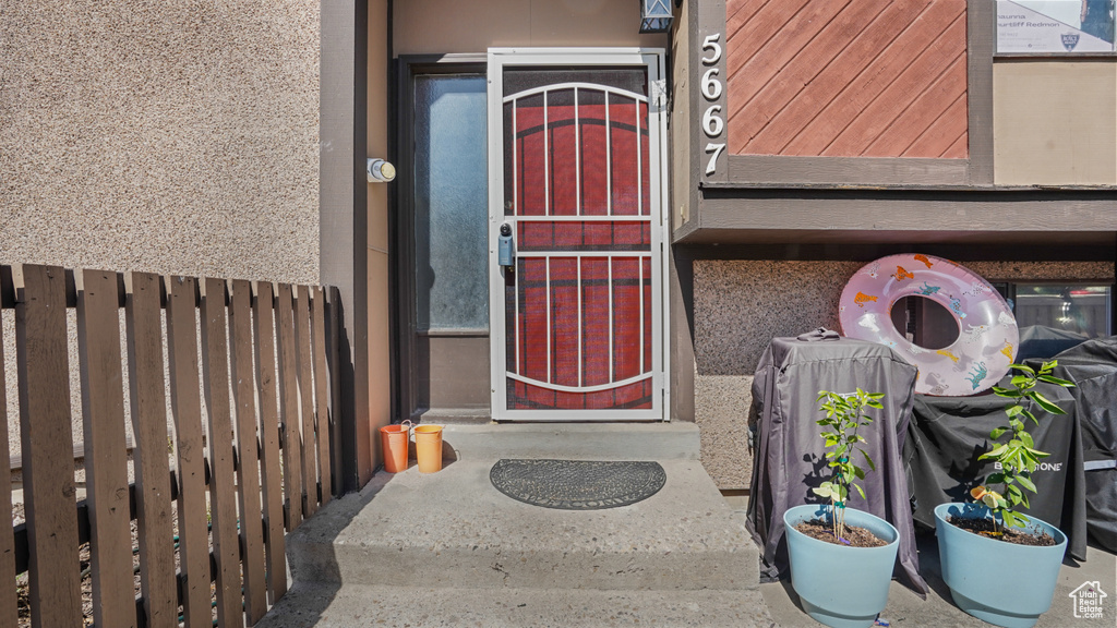 Doorway to property with stucco siding