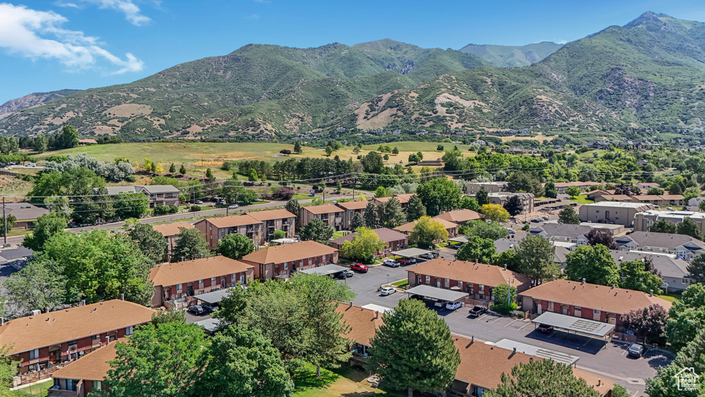 Aerial view of residential area featuring a mountain backdrop
