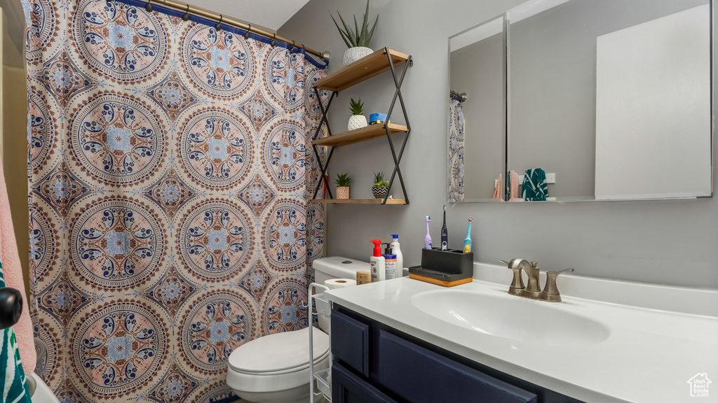 Full bathroom with vanity and a shower with shower curtain
