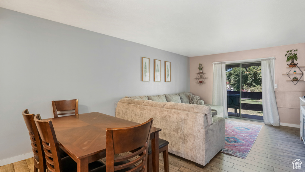 Dining area with light wood-style flooring
