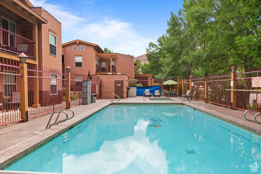 Community pool featuring a patio area
