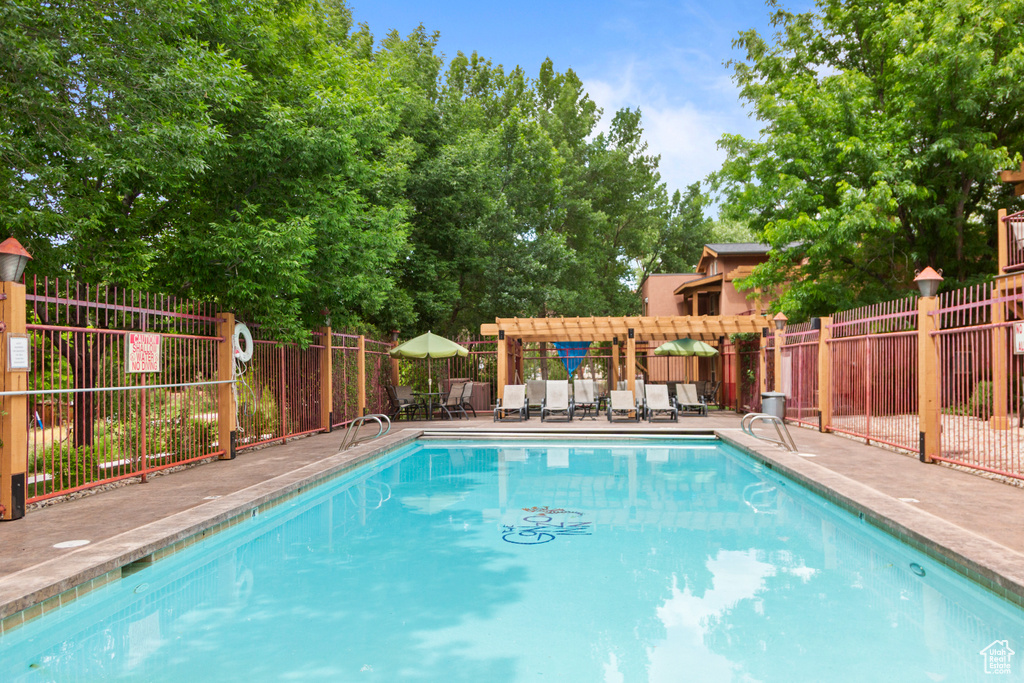 Community pool featuring a patio area