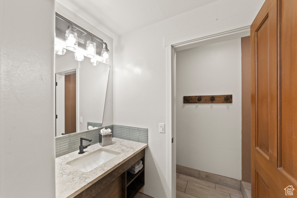 Bathroom featuring vanity and tile patterned flooring