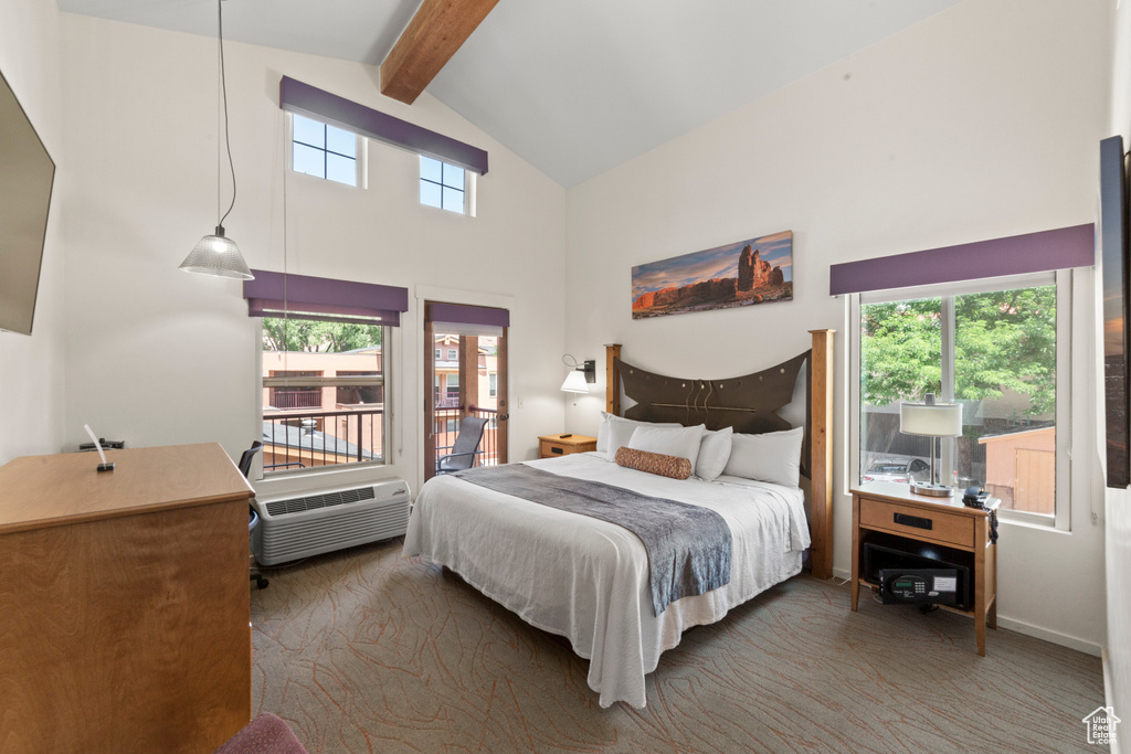 Carpeted bedroom featuring high vaulted ceiling, beamed ceiling, multiple windows, and access to outside