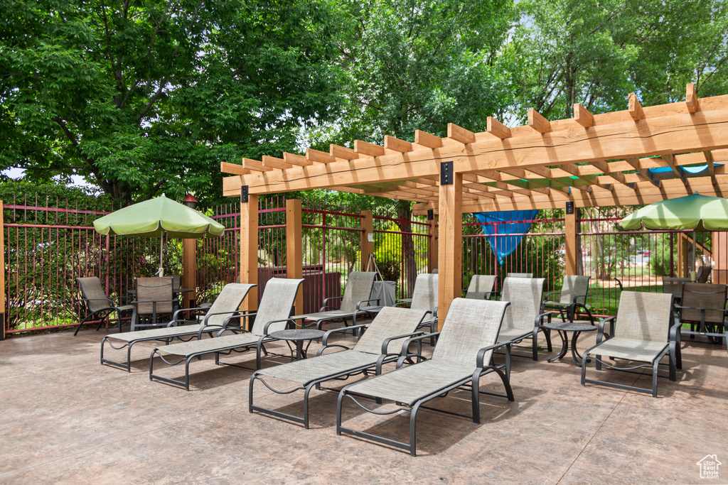View of patio / terrace featuring a pergola and outdoor dining area