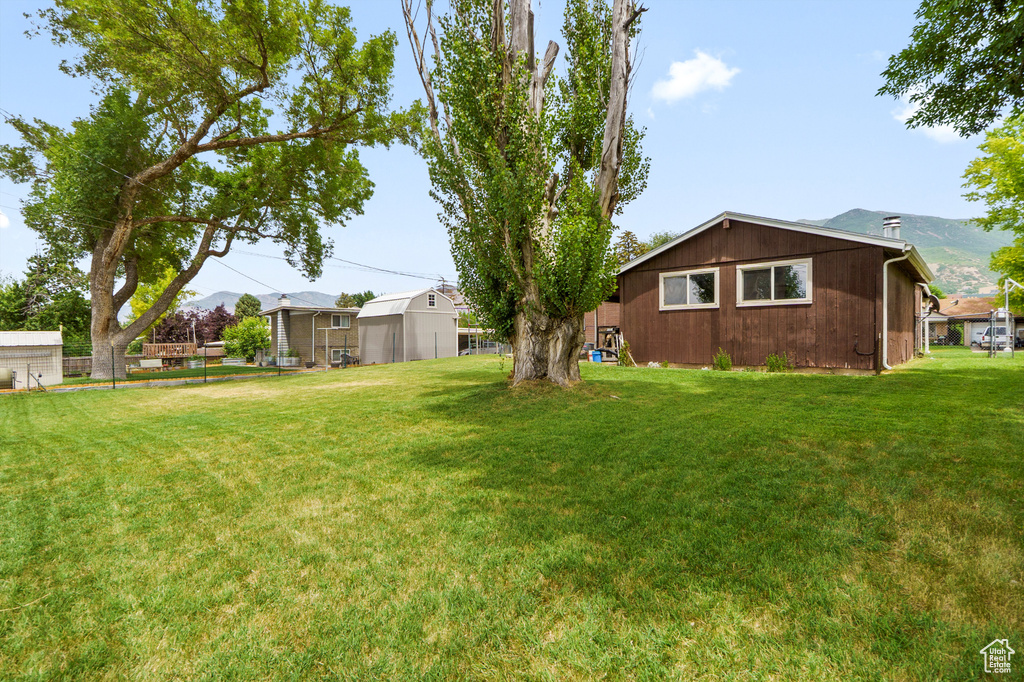 View of yard with an outbuilding