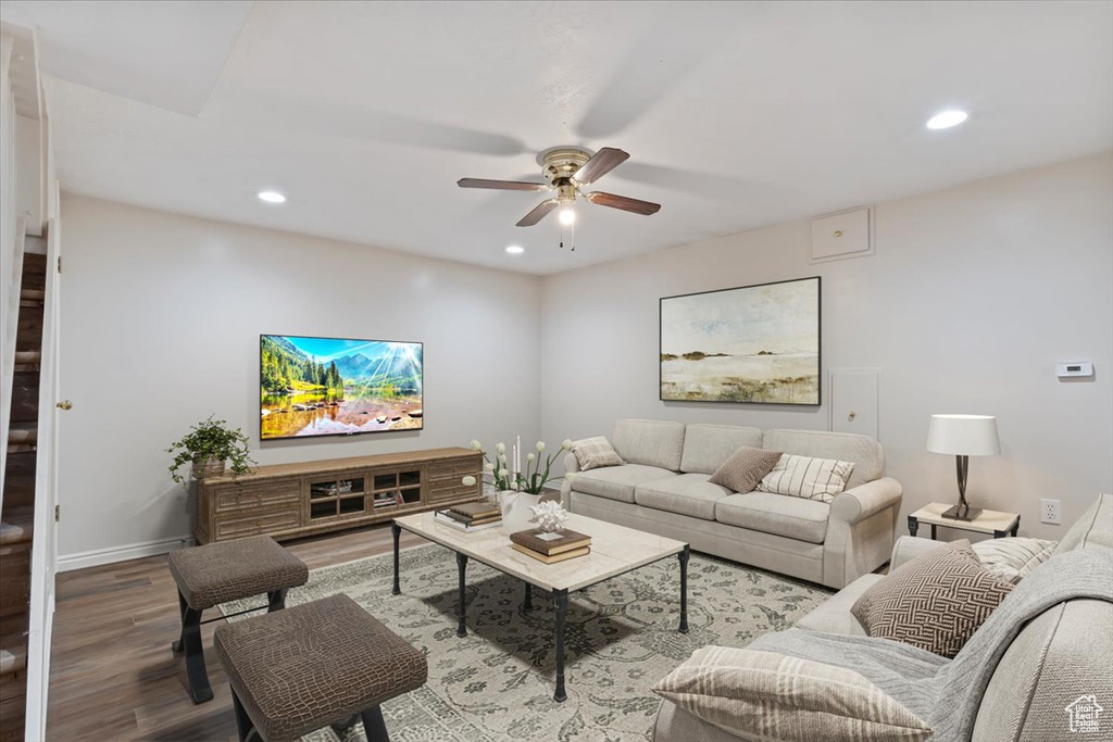 Living area featuring ceiling fan, wood finished floors, and recessed lighting