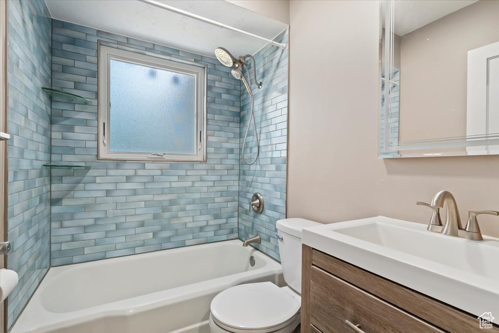 Full bathroom with vanity and bathtub / shower combination