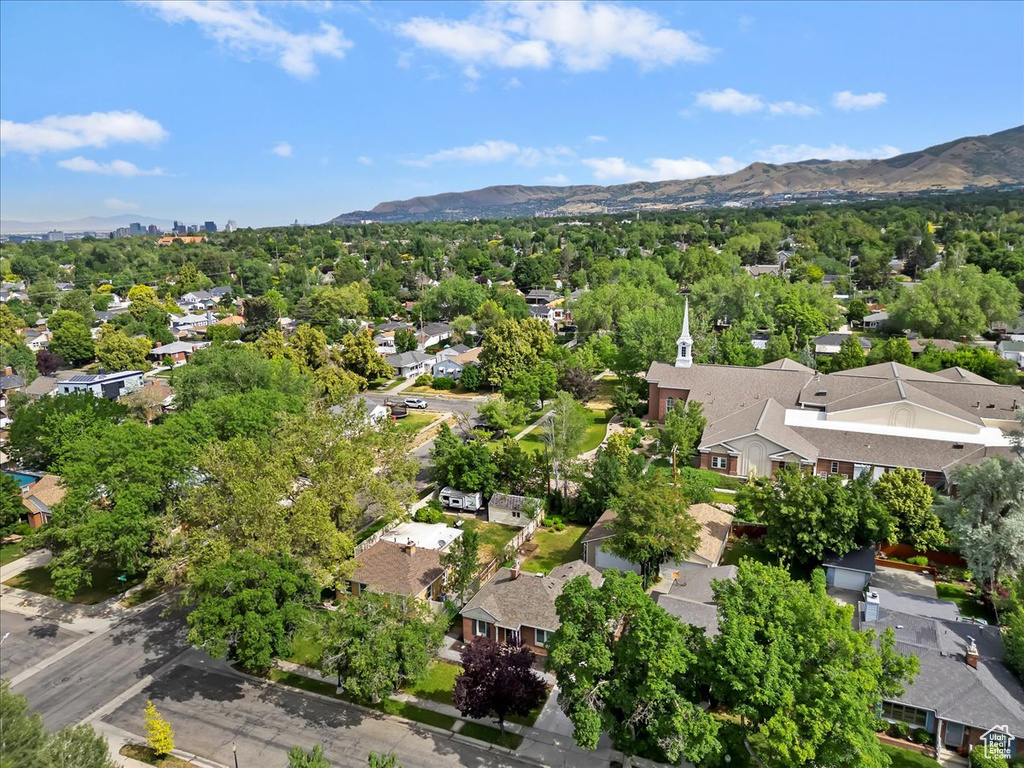 Aerial perspective of suburban area with a mountain backdrop