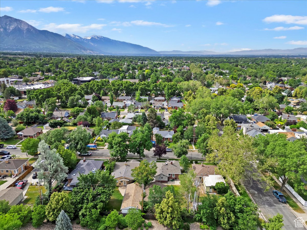 Aerial perspective of suburban area featuring a mountainous background