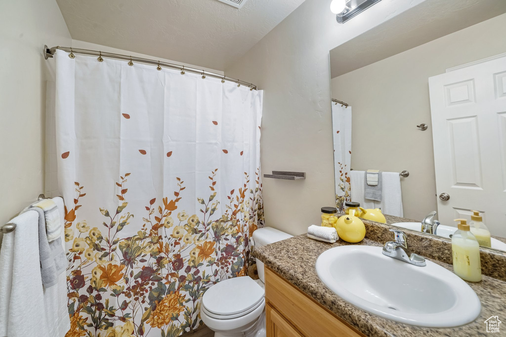 Bathroom with vanity and a shower with curtain