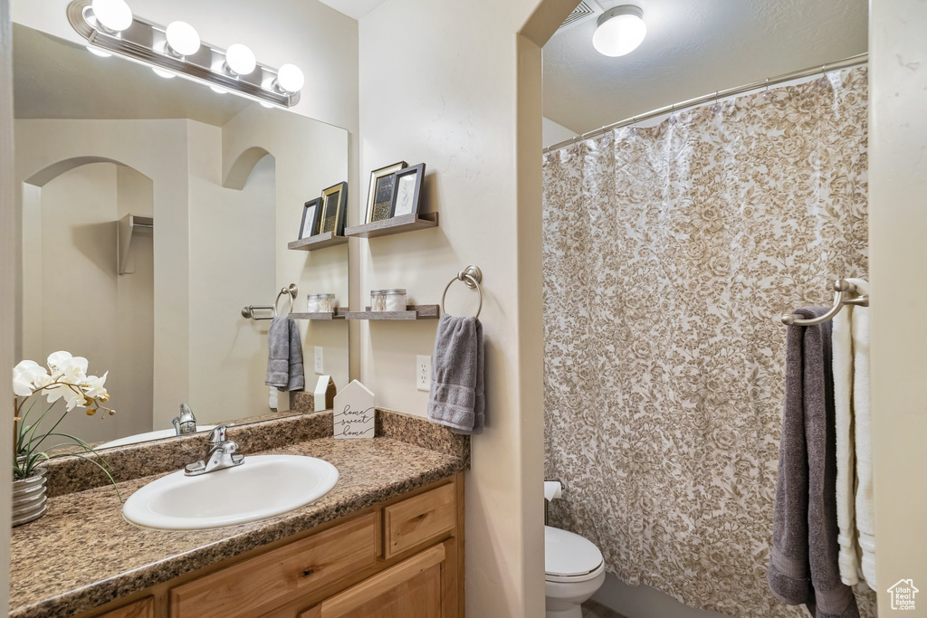 Bathroom with vanity and a shower with curtain