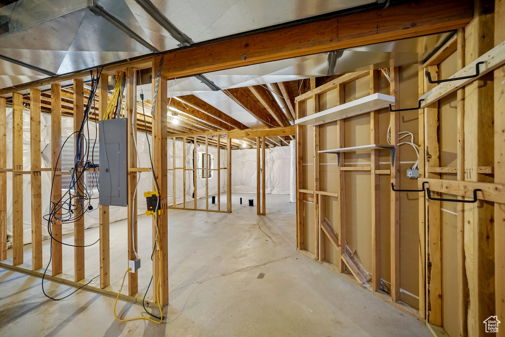 Unfinished below grade area featuring electric panel
