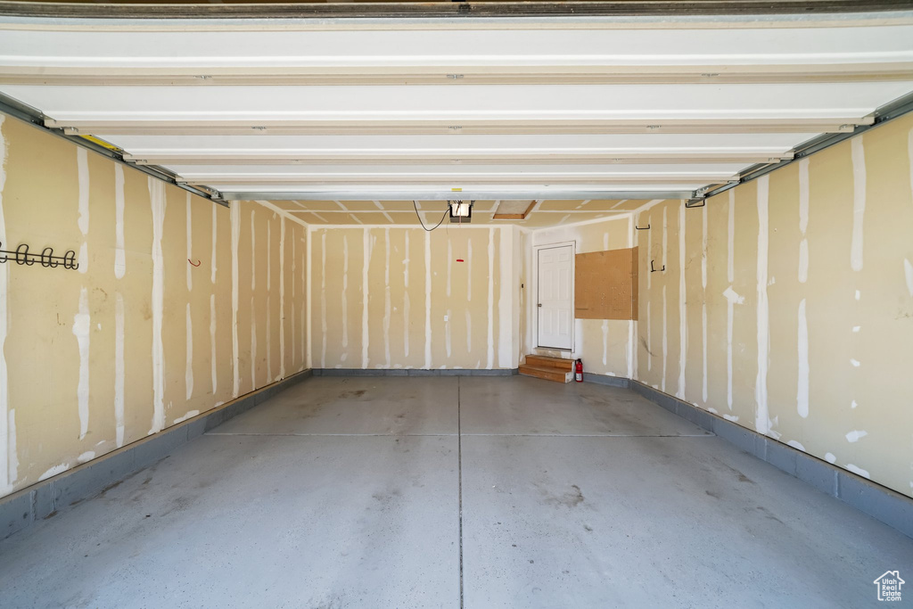 Garage featuring a garage door opener