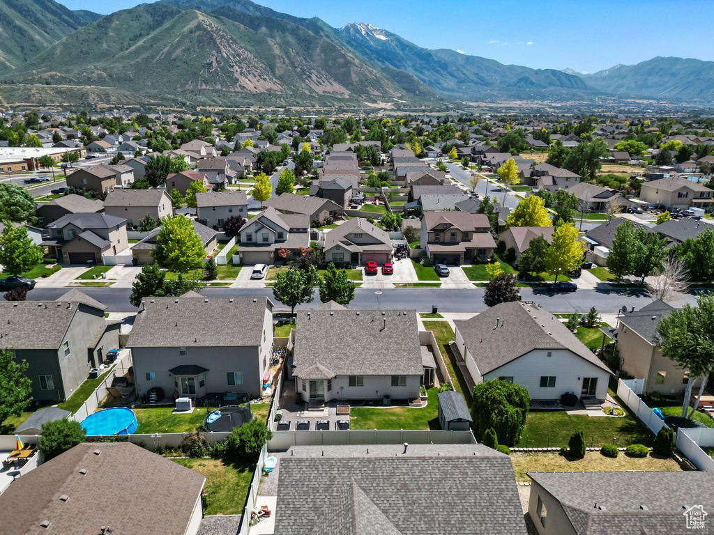 Aerial perspective of suburban area with a mountainous background