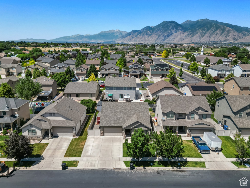 Aerial view of residential area featuring a mountain backdrop
