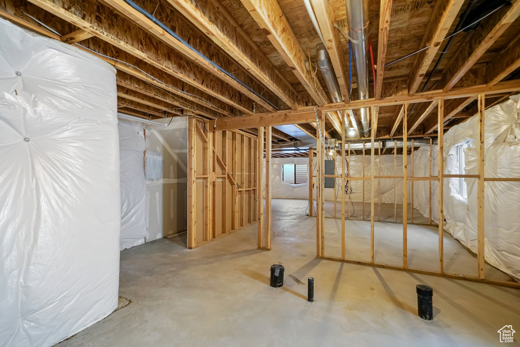 Unfinished below grade area featuring electric panel