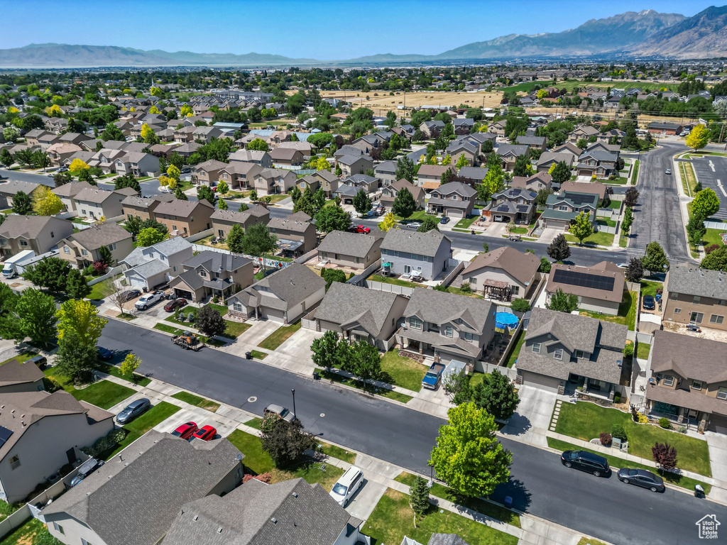 Aerial perspective of suburban area featuring a mountain backdrop