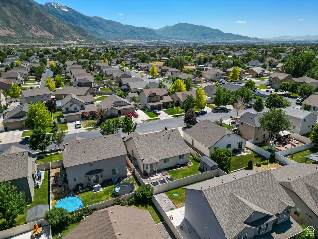 Aerial view of residential area with a mountainous background