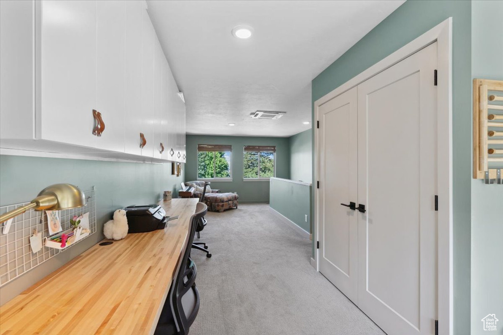 Home office featuring carpet floors and recessed lighting