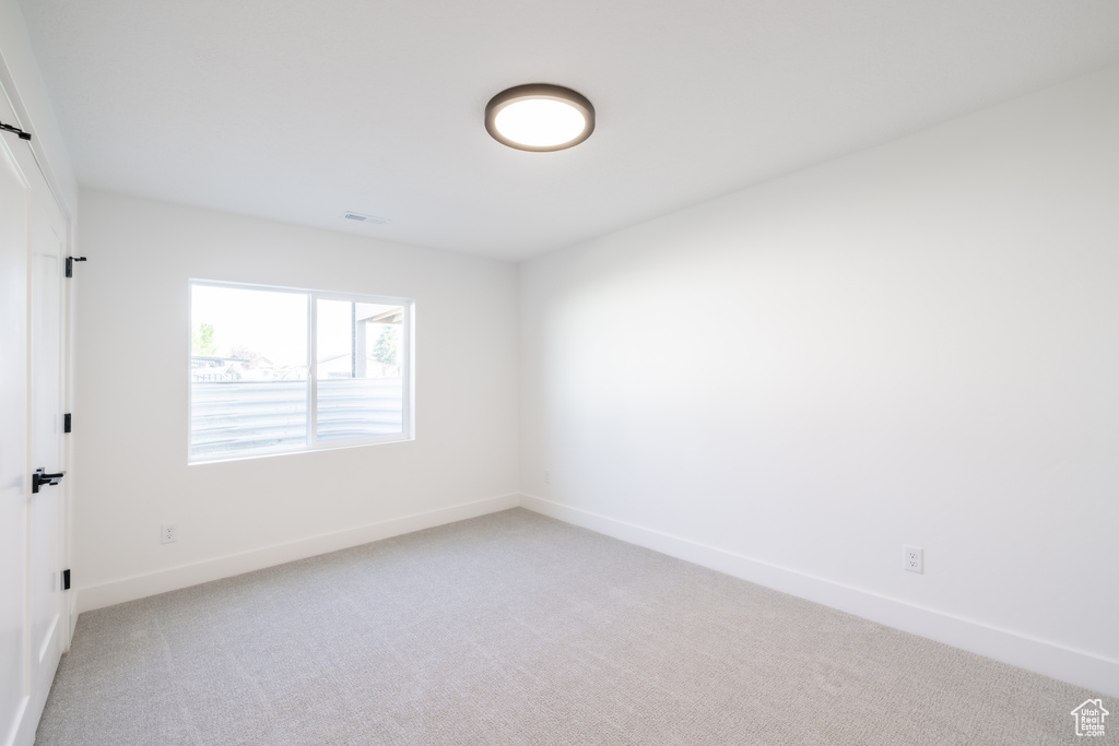 Spare room with light carpet
