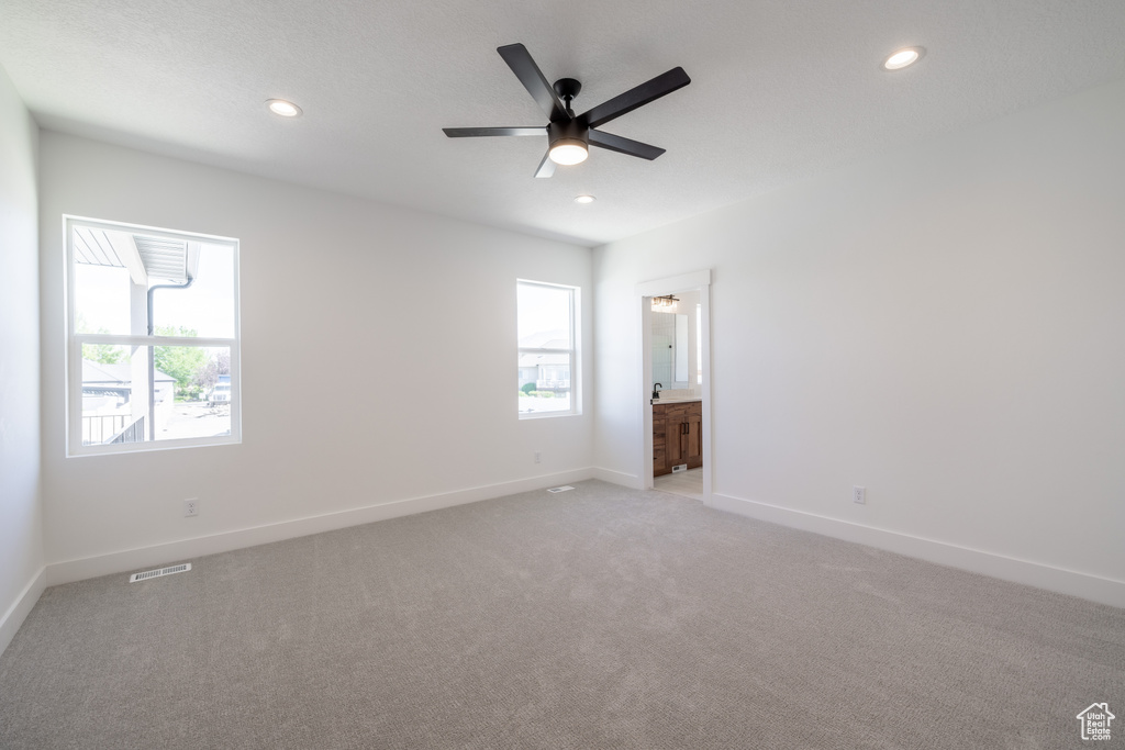 Unfurnished room with recessed lighting, light carpet, and a ceiling fan