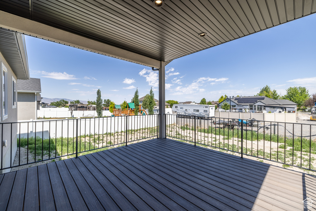 Wooden deck with a residential view